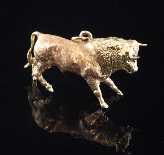 An 18ct gold bracelet charm, modelled as a bull, 1.25in.